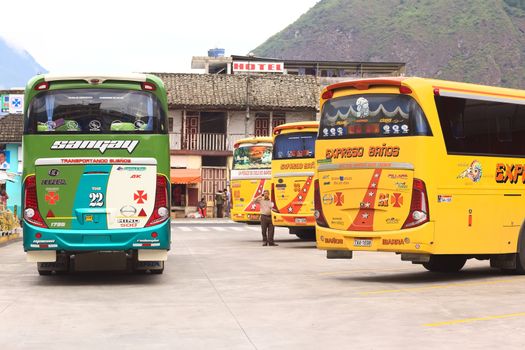 BANOS, ECUADOR - FEBRUARY 22, 2014: Buses at the bus terminal on February 22, 2014 in Banos, Ecuador. 