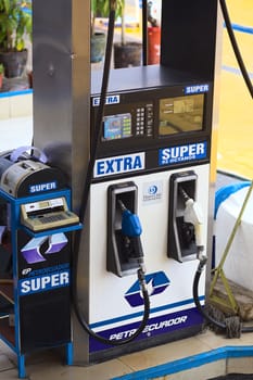 TUNGURAHUA, ECUADOR - MAY 12, 2014: Fuel dispenser at a gas station of the company Petroecuador along the road between Ambato and Banos on May 12, 2014 in Tungurahua Province, Ecuador