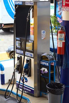 TUNGURAHUA, ECUADOR - MAY 12, 2014: Fuel dispenser at a gas station of the company Petroecuador along the road between Ambato and Banos on May 12, 2014 in Tungurahua Province, Ecuador. 