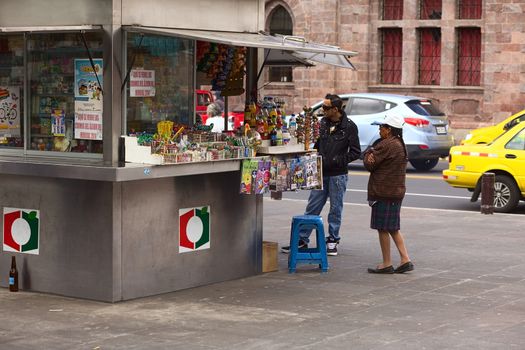 AMBATO, ECUADOR - JUNE 23, 2014: Unidentified people at snack stand in Cevallos Park in the city center on June 23, 2014 in Ambato, Ecuador. Ambato is the capital of Tungurahua Province in Central Ecuador.  