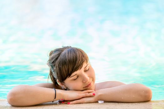 girl enjoys the pool in the hotel