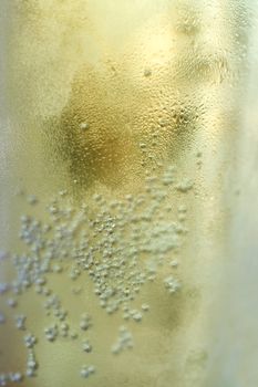 bubbles rising to the surface of the drink. close up