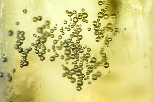 bubbles rising to the surface of the drink. close up