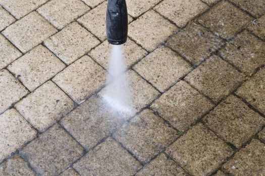 Outdoor floor cleaning with high pressure water jet