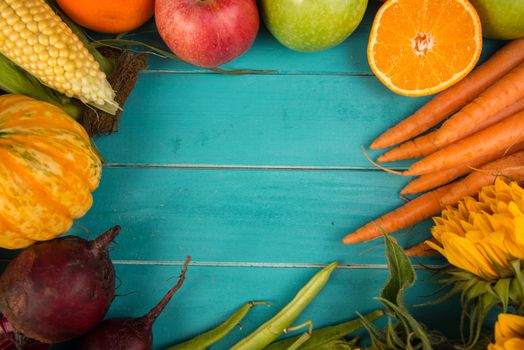 Farm fresh organic vegetables on rustic wooden blue table background