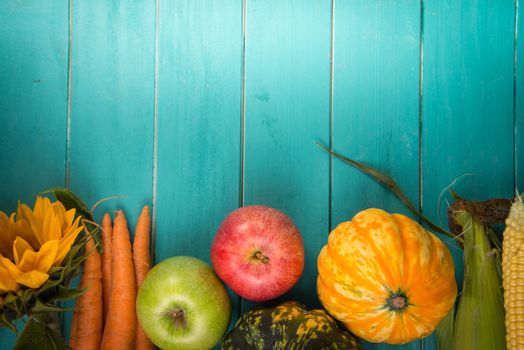 Farm fresh organic vegetables on rustic wooden blue table background