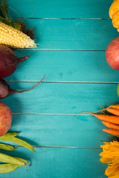 Farm fresh organic vegetables on rustic wooden blue table background