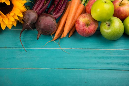 Farm fresh organic vegetables on rustic wooden blue table background