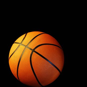 One basketball on black background 