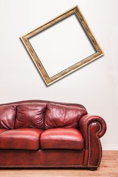 Luxurious Red Leather Couch in front of a blank crooked frame to ad your text, logo, images, etc.