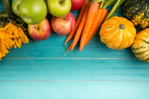 Farm fresh organic vegetables on rustic wooden blue table background