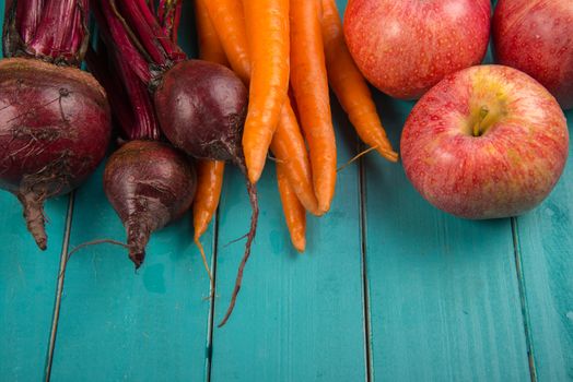 Farm fresh organic vegetables on rustic wooden blue table background