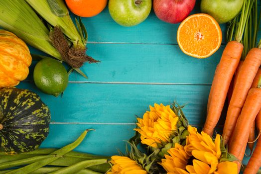 Farm fresh organic vegetables on rustic wooden blue table background