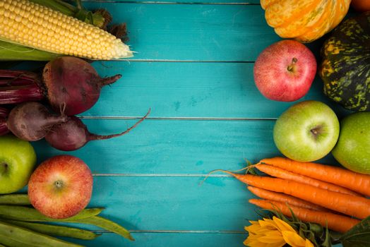 Farm fresh organic vegetables on rustic wooden blue table background