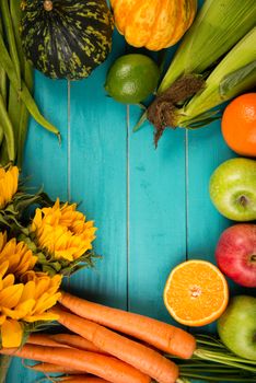 Farm fresh organic vegetables on rustic wooden blue table background