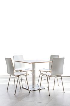 tables and chairs set on floor isolated on white background