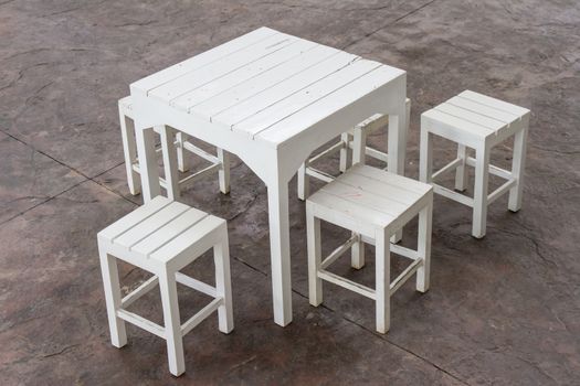 white wooden table and chairs set