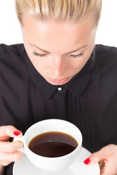 Business woman holding white cup of coffee in her hands. Coffee break.