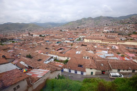 a view of red roofs in a historic area of Cuzco in Peru