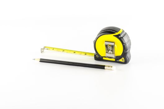 measuring tape with pencil on a white background
