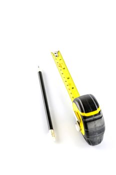 measuring tape with pencil on a white background