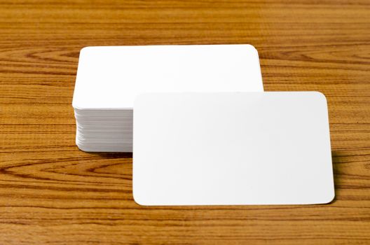 stack of business card on wood background