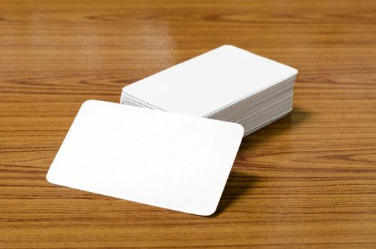 stack of business card on wood background
