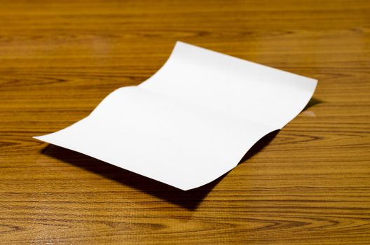 paper on wood background