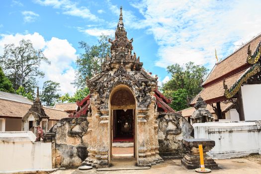 Archway to ancient lanna style temple in thailand