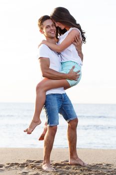 Summer, sea. Cute, lovely couple on the beach