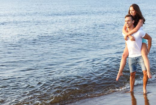 Summer, sea. Cute, lovely couple on the beach