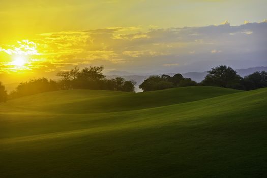 Golden sunrise on golf greens, Philippines