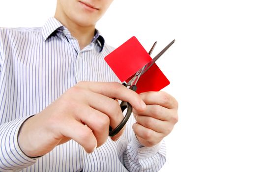 Person cutting a Credit Card Closeup on the White Background