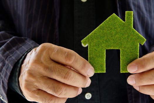 hand holding eco house icon concept