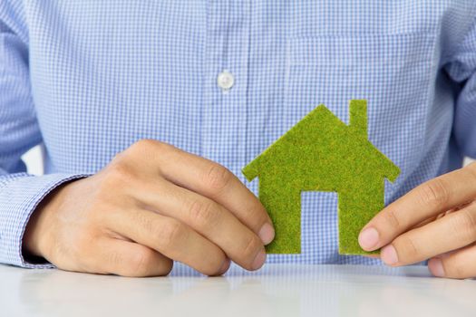 hand holding eco house icon concept