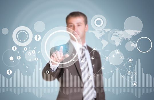 Businessman in suit finger presses virtual button. Graphs as backdrop