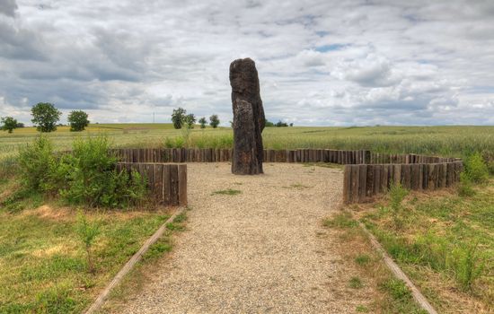 Menhir Stone Shepherd (also Stone Man, Petrified Man or Petrified minister) is a menhir standing alone in a field 1 km northwest of the village Klobuky, district Kladno. This is the highest menhir in the Czech Republic.  3.5 m tall columnar rock uncut dark iron Cretaceous sandstone. This is one of the few stones in the country, which we can with high probability be considered a real prehistoric menhir.