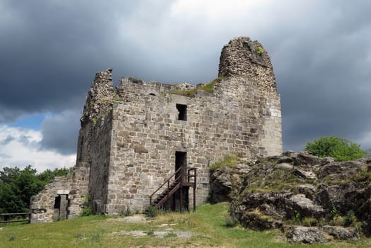 Primda castle - the one from the oldest stone castles in Czech republic.
The first mention of Primda castle dates from the year 1121.
The ruins of the castle Primda stands at the southern end of the rocky ridge above the Primda village on Tachov Region. Primda is considered to be the oldest surviving stone castle in Bohemia and is protected as a national monument. The castle has been preserved ruins of a massive rectangular Romanesque residential tower, which was built of quarried stone. Also there are remains of a cylindrical tower from the late 15th century.
Primda, Czech republic.