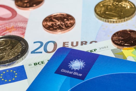 MUNICH, GERMANY - FEBRUARY 23, 2014: Tax Free plastic card from company Global Blue on banknotes