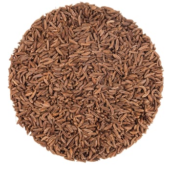 Closeup of Caraway Seeds texture on a Perfect Circle Isolated on White Background