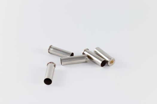 Five fired cartridge cases, caliber .357 Magnum, silver