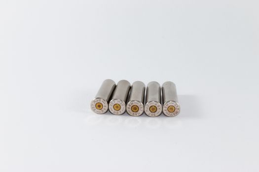 Five fired cartridge cases, caliber .357 Magnum, silver color