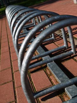 Metal spiral holder for bikes set up in front of store