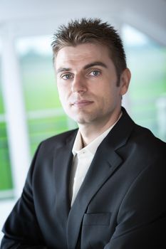 Image of a business man in dark suit