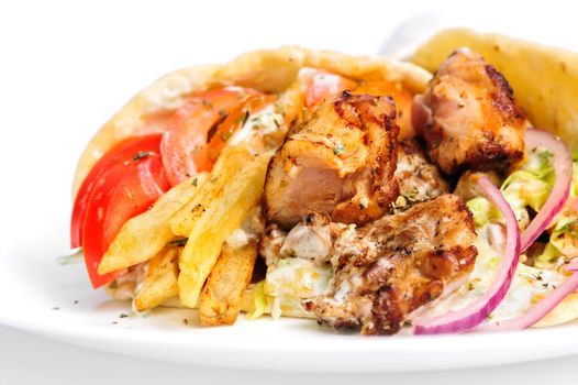 greek gyros stuffed with meat, salad, onion, tomato and potato