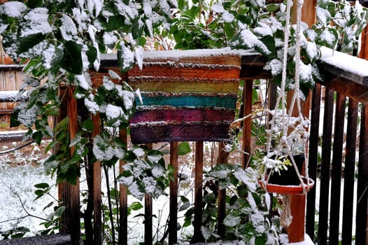 Winter snow on patio deck outdoors.