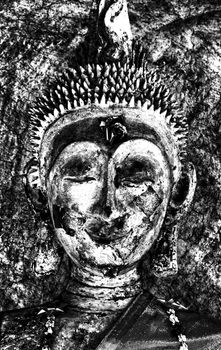 Black silhouette of Buddha face.