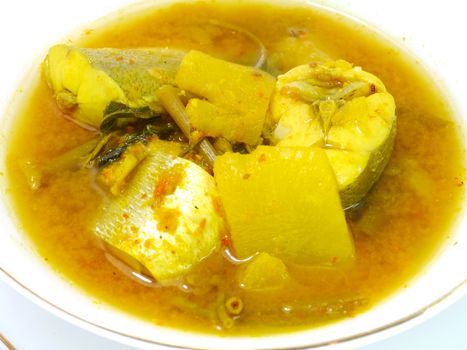 Yellow fish curry with pineapple.