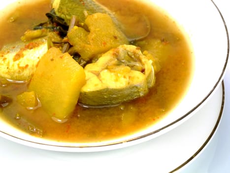 Yellow fish curry with pineapple.