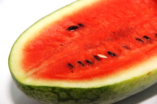 Sliced watermelon on plate isolated on a white background.